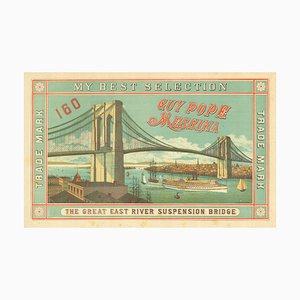 Etiqueta de caja naranja con escasa publicidad con el puente de Brooklyn