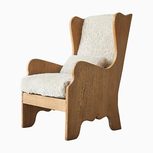 Lounge Chair in Oak and Sheepskin in thesStyle of Axel Einar Hjorth, 1920s