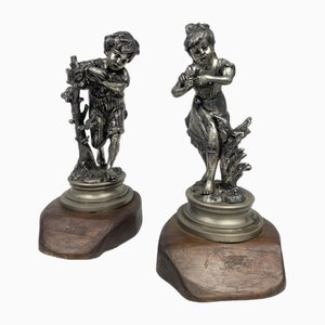 Estatuas de niños jugando, años 20, metal, Juego de 2