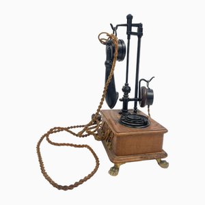 Teléfono giratorio vintage de madera, años 50