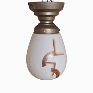 Art Deco German Ceiling Lamp with Teardrop-Shaped White Glass Shade with Orange-Silver Geometric Spray Decorative Motif on Nickel-Plated Metal Mount from Zenith, 1920s