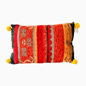 Coussin en tissu cramoisi et doré