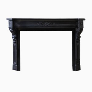 Repisa de chimenea Modillion antigua de mármol negro