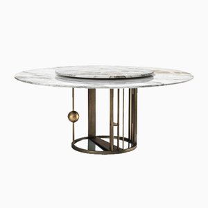 Tavolo da pranzo rotondo Merlino in metallo e marmo di Paolo Rizzatto