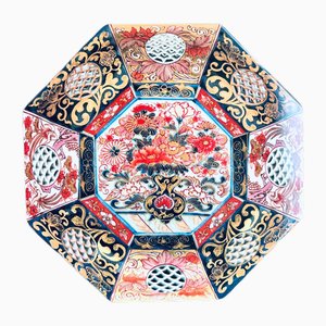 Cargadores octogonales de melamina en rojo y azul de la colección Illusions de Vito Nesta