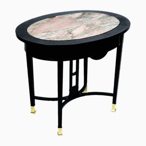 Mesa de comedor modernista con plato de mármol rojizo y patas de latón, Viena, años 10