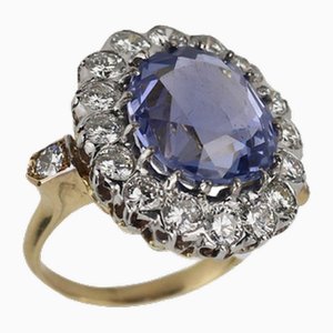 Excellent 18k Gold Ring with 10.96 Carat Sapphire and a Scattering of Diamonds., 2000s