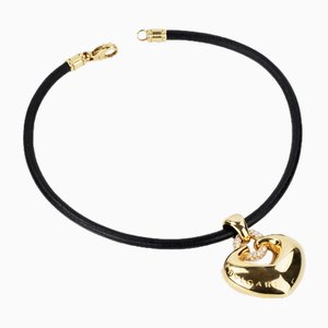 Pendente Bulgari in oro e diamanti a forma di cuore con cinturino in caucciù, anni 2000