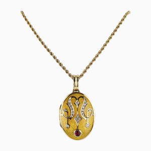 Gold Pendant on a Chain with a Ruby, in the Original Case. Faberge, France., 2000s