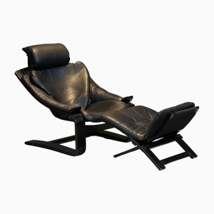 Sillón Kroken vintage de cuero negro y otomana atribuido a Åke Fribytter para Nelo Möbel, Suecia, años 70. Juego de 2