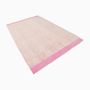 Tappeto in morbida lana con pompon