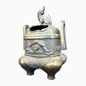 Bruciaprofumo cinese in bronzo decorato con un cane e un drago, fine XIX secolo