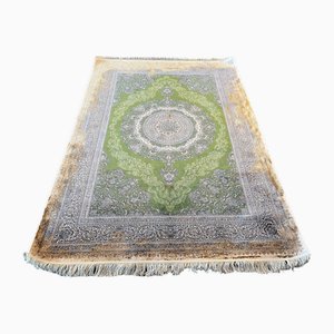 Tappeto in seta verde e oro