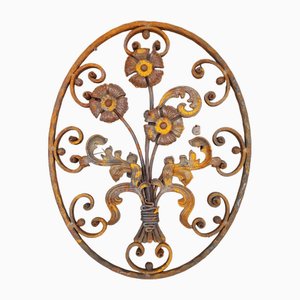 Elemento decorativo Art Nouveau ovale in ferro battuto con fiori