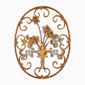 Elemento decorativo Art Nouveau ovale in ferro battuto con fiori