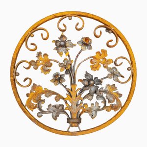 Elemento decorativo Art Nouveau rotondo in ferro battuto con fiori