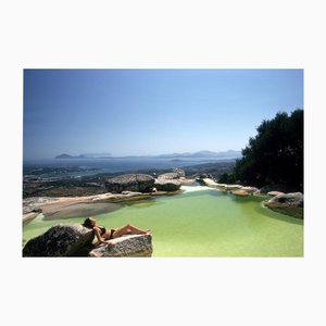 Slim Aarons, Sunbather on Rock, Estate Stamped C-type Print