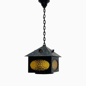 Lanterna Arts & Crafts in ferro battuto con vetro giallo