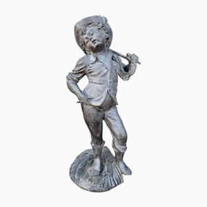 Statua antica in bronzo di Contadino con flagello