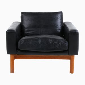 Sillón Mid-Century de cuero y roble de Poul M. Volther, 1969