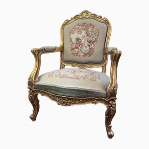Silla de madera dorada y tapicería