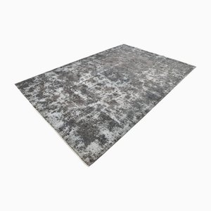 Tappeto vintage in lana sbiadita