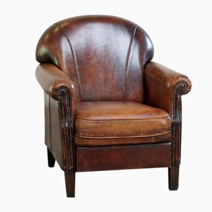 Poltrona in pelle marrone scuro