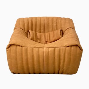 Poltrona Sandra con cuscino in spessa pelle color cammello di Annie Hiéronimus per Cinna/Ligne Roset, Francia