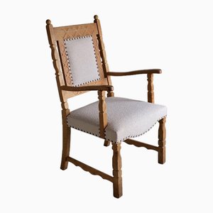 Carved Oak Armchair attributed to Henning Kjaernulf, Denmark, 1960s