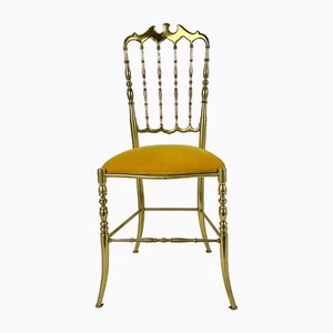 Silla auxiliar antigua de bronce