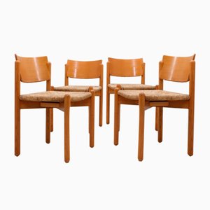 Sillas de comedor vintage de madera con asiento de paja, años 70. Juego de 4