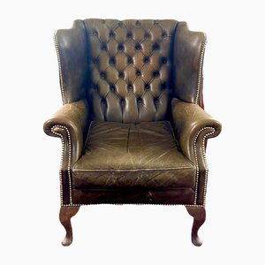 Poltrona Chesterfield in pelle marrone verde