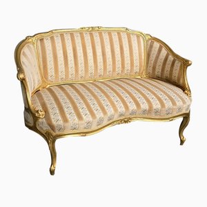 Französische geschwungene vergoldete Couch
