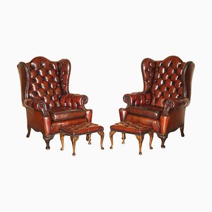Vintage Chesterfield Wingback Armchairs and Footstools in Oxblood Leather, Set of 4