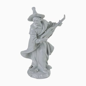 Figura antigua de porcelana de hombre oriental