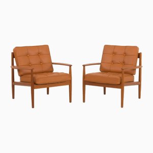 Sillones de teca de cuero anilina coñac para Cado de Grete Jalk, Dinamarca, años 60. Juego de 2
