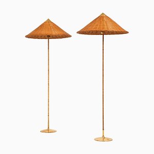 Floor Lamps in Brass, Cane and Rattan Shades attributed to Paavo Tynell, 1950s, Set of 2