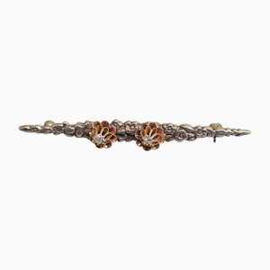 Silberne Brochette mit Goldrosetten und Diamanten, 1900er