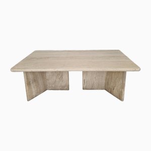 Mesa de centro italiana robusta de travertino con dos patas de tres patas, años 80