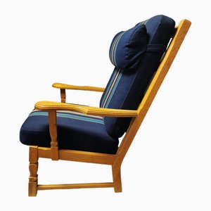 Armchair with High Back in Oak with Carvings in the style of Henning Kjærnulf for Eg Furniture, Denmark, 1960s