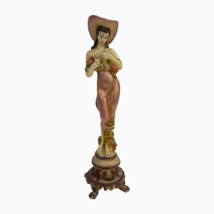Figura decorativa que representa a una mujer floral, años 60
