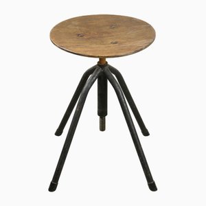 Industrieller italienischer Mid-Century Drehhocker aus schwarzem Metall & Schichtholz, 1950er