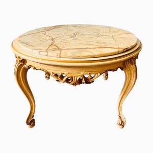 Mesa de centro barroca vintage con tablero de mármol y base de madera tallada ornamentada