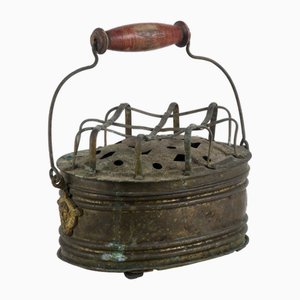 Calentador antiguo de latón con asa de madera, siglo XIX