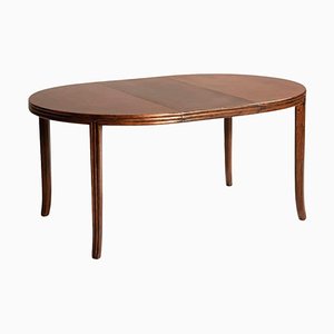 Tavolo rotondo allungabile Mc Guire in legno, anni '70