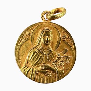 Colgante con forma de medalla St. Therese francesa de oro amarillo de 18 kt de Mazzoni, década de 1890