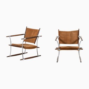 Poltronas de palisandro y estructura de acero atribuidos a Jens Harald Quistgaard, años 60. Juego de 2