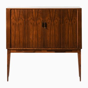 Meuble de Bar avec Portes Tambour en Palissandre et Laiton attribué à Kurt Østervig, 1960s