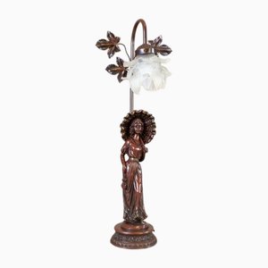 Lampada da notte in lega di zama con statuetta di donna, XX secolo