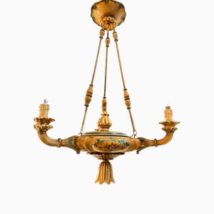 Lámpara colgante de cuatro luces de madera decorada